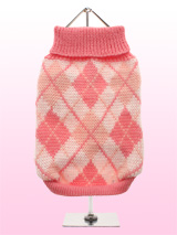 Pink Argyle Sweater - This knitted pink sweater with a baby pink and white diamond pattern is made from a high quality natural wool. The Argyle pattern has seen a resurgence in popularity in the last few years due to its adoption by Stuart Stockdale in collections produced by luxury clothing manufacturer, Pringle of Scot...
