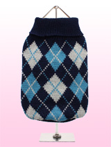 Blue Argyle Sweater - This knitted blue sweater with a baby blue and white diamond pattern is made from a high quality natural wool. The Argyle pattern has seen a resurgence in popularity in the last few years due to its adoption by Stuart Stockdale in collections produced by luxury clothing manufacturer, Pringle of Scot...
